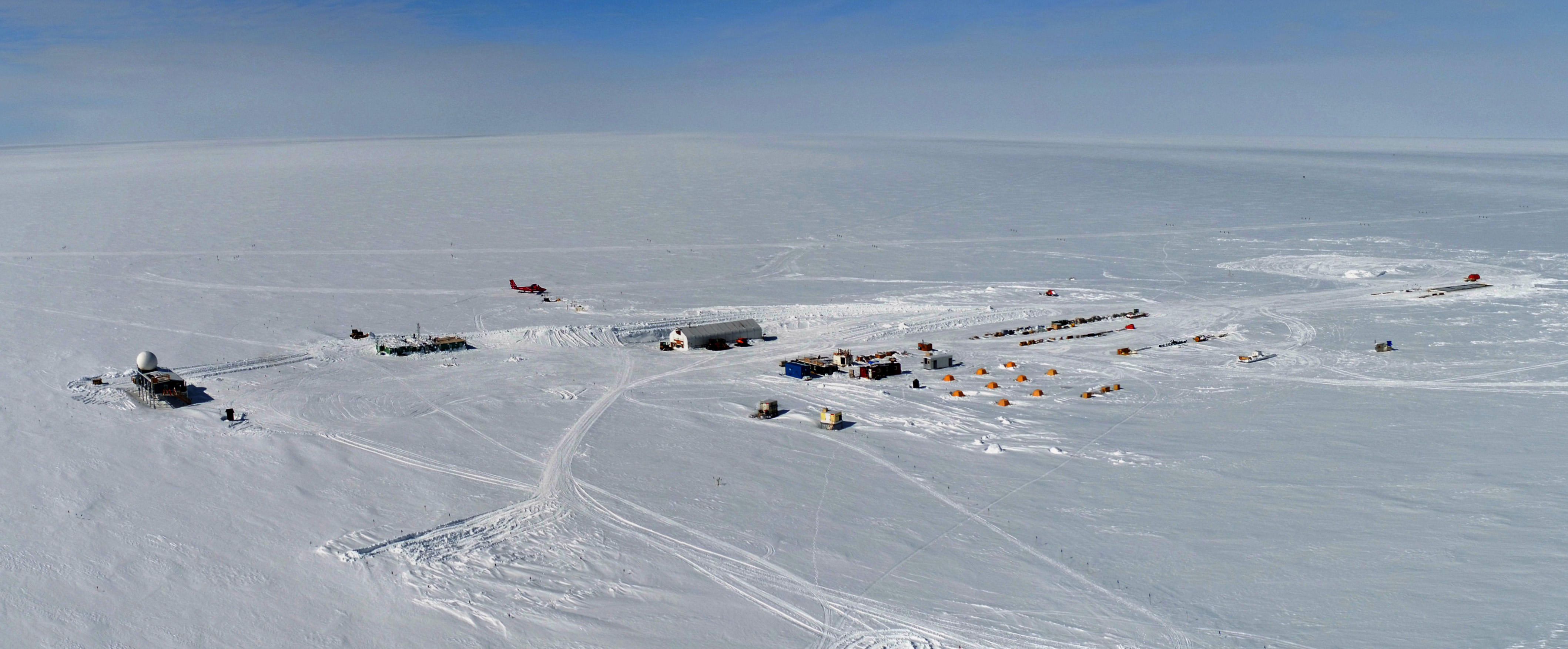 Aerial view of the US research station in a vast swath of snow in Greenland.