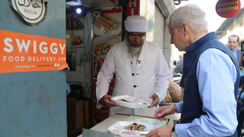 Ken Juster buying food at a Halal food truck