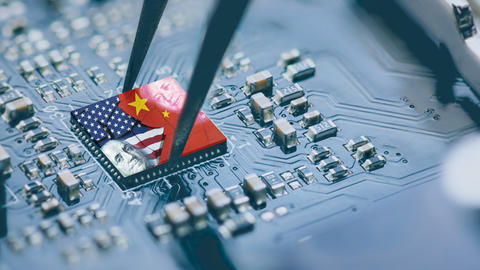 close up microchip and tweezers