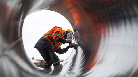 Worker in a section of pipe along the Trans-Anatolian Natural Gas Pipeline