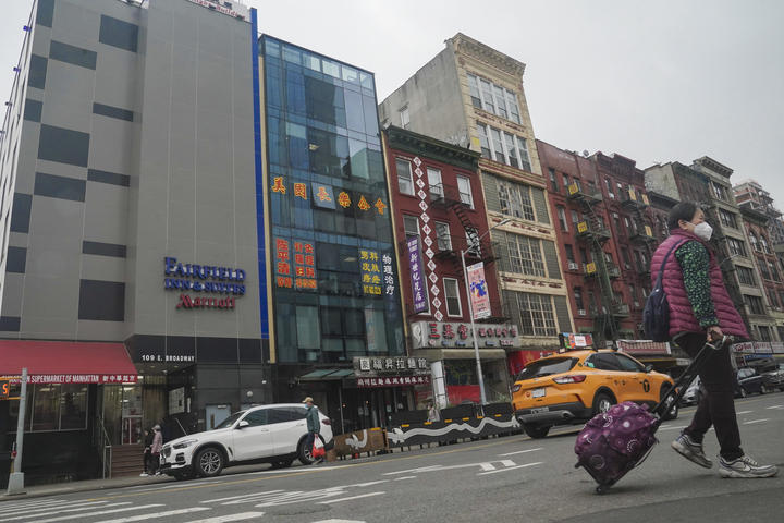 A street photo of a six-story glass facade building, believed to be the site of a foreign police outpost for China in New York's Chinatown.
