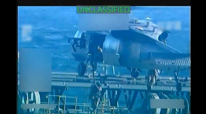 Screenshot of a video of US armed forces descending from a helicopter onto an oil tanker.