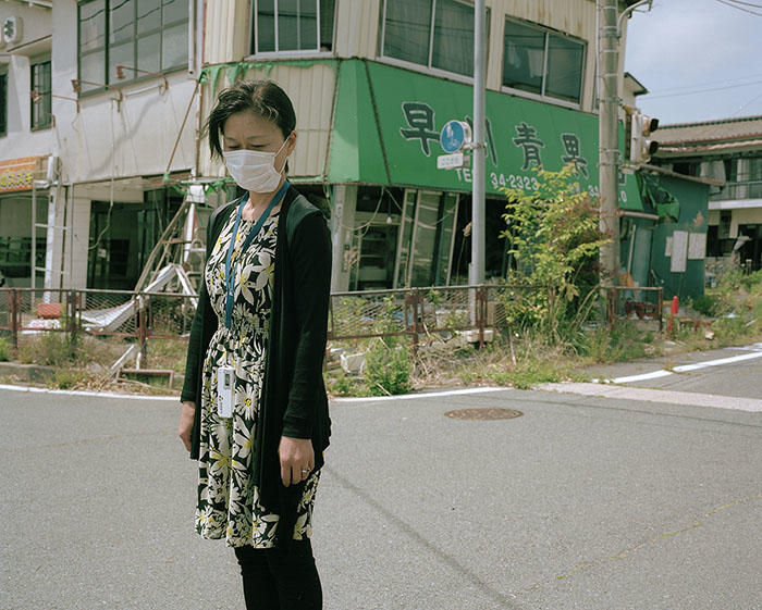 Image of woman in mask on street