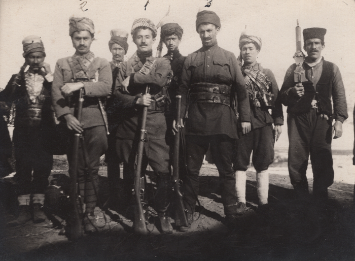 Archival photo from circa 1926-1930 of 8 leaders of the Ararat Rebellion posing with guns.