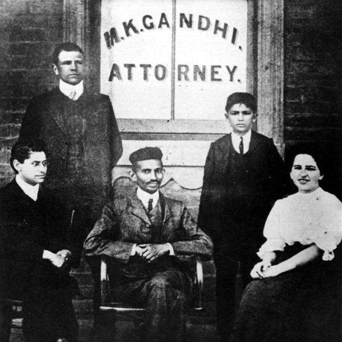 Old photograph of Ghandi and colleagues in front of his law office in South Africa.