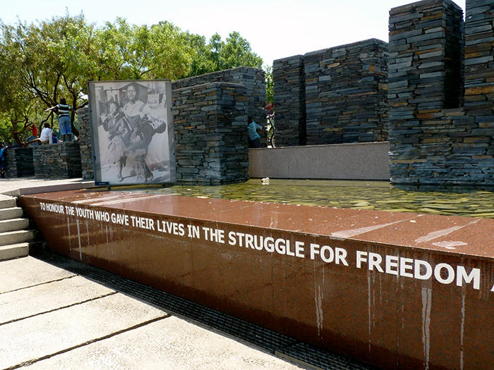 Hector Pieterson Memorial stone wall with the words 
