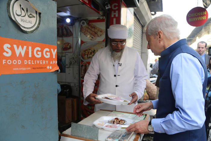 Ken Juster buying food at a Halal food truck