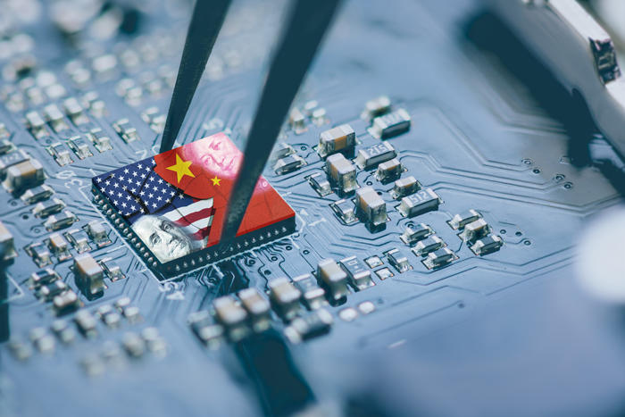 close up microchip and tweezers