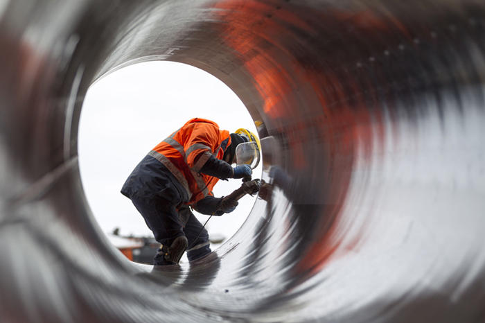 Worker in a section of pipe along the Trans-Anatolian Natural Gas Pipeline