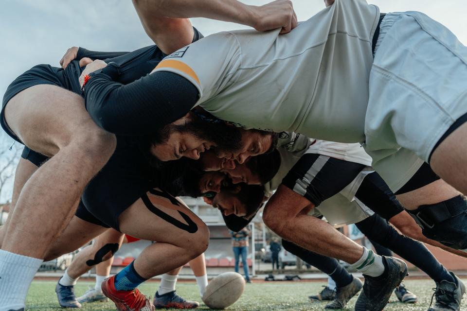 Close-up profile of rugby scrum.